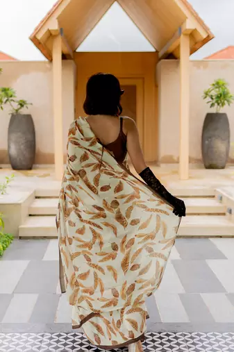 Cream satin georgette leaf print plain saree with unstitched blouse piece