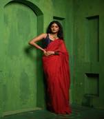 Red handloom mul cotton saree, beautifully accented with matching red tassels on the pallu.