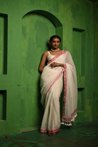 Huts and looms white handloom cotton saree, with an embroidered lace border