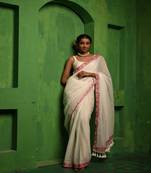 Huts and looms white handloom cotton saree, with an embroidered lace border