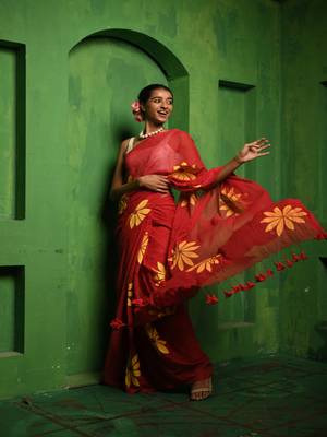 Huts and looms red handloom cotton saree, featuring exquisite hand-painted floral designs throughout the saree. 1