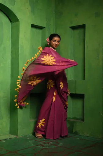 Huts and looms purple handloom cotton saree, featuring exquisite hand-painted floral designs throughout the saree.