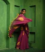 Huts and looms purple handloom cotton saree, featuring exquisite hand-painted floral designs throughout the saree.