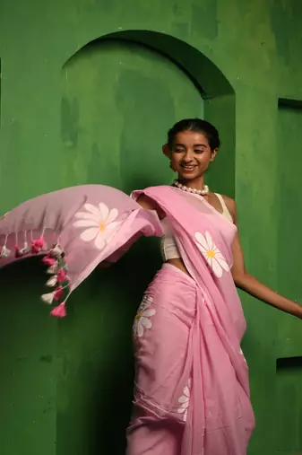 Huts and looms pink handloom cotton saree, featuring exquisite hand-painted floral designs throughout the saree.