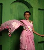 Huts and looms pink handloom cotton saree, featuring exquisite hand-painted floral designs throughout the saree.