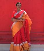 The exquisite red cotton saree  with silver and gold border
