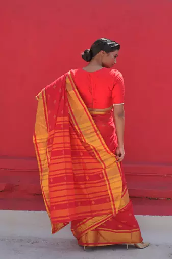 Huts and looms exquisite red handwoven cotton saree with golden jamdani motifs