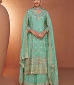 Turquoise embroidered chinnon  free size stitched straight palazzo suit. (size upto 42)