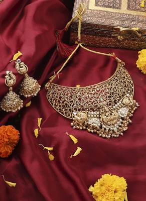 Gold-Plated Statement Choker Set with Lakshmi Motif and Intricate Designs 1