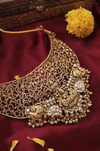 Gold-Plated Statement Choker Set with Lakshmi Motif and Intricate Designs