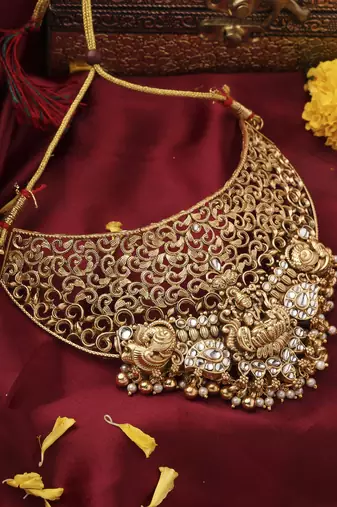 Gold-Plated Statement Choker Set with Lakshmi Motif and Intricate Designs