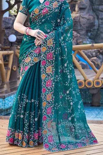 Siroski Resham Stone Embroidered Border Silk Saree In Teal Blue With Matching Blouse Piece