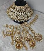 Opulent kundan bridal jewelry set with pearl embellishments