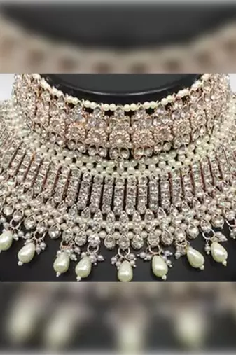 Exquisite crystal and pearl bridal choker set with matching earrings and tikka