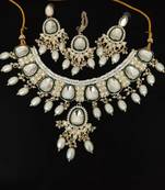 Elegant pearl and kundan necklace set with green enamel accents