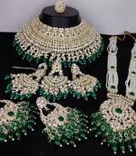 Luxurious pearl kundan bridal jewelry set - necklace, earrings, tikka, and long necklace