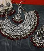 Exquisite kundan meena bridal necklace set with matching earrings and tikka