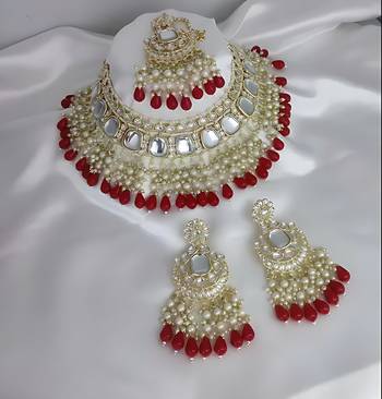 Luxurious kundan choker set with pearl and red bead accents - traditional indian bridal jewelry 1