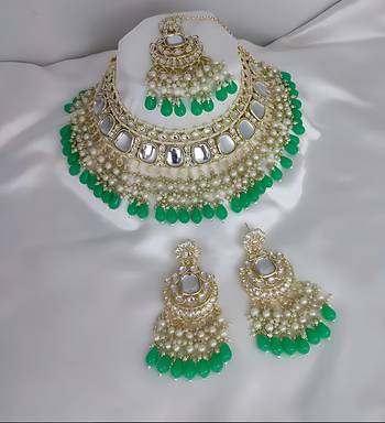 Luxurious kundan choker set with pearl and green bead accents - traditional indian bridal jewelry 1
