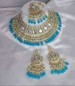 Luxurious kundan choker set with pearl and turquoise bead accents - traditional indian bridal jewelry