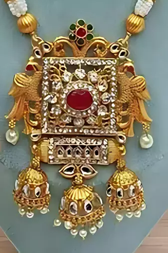 Elegant white pearl and gold kundan necklace set with ornate pendant