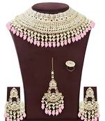 Opulent bridal kundan choker set with pink beads and matching earrings & maang tikka