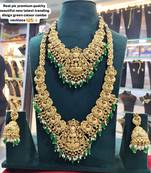 Premium gold plated double layer lakshmi temple necklace set with emerald green beads | traditional wedding jewelry