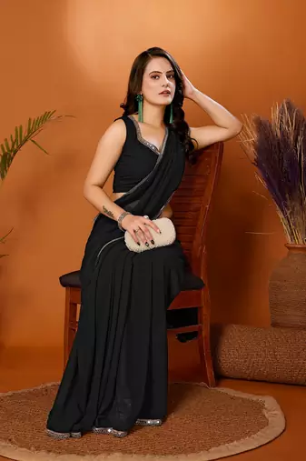 Black color pure georgette saree with blouse piece