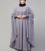 Nazneen smoking at sleeve Irani kaftan