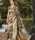 Exquisite designs with this coffee brown simar silk zari woven saree