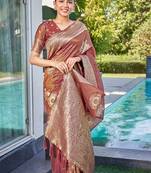 Exquisite designs with this rust simar silk zari woven saree