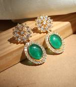 Elegant kundan earrings with green stones
