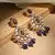 Kundan earrings with purple drops