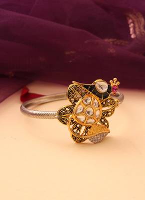 Silver peacock bracelet with floral accents 1