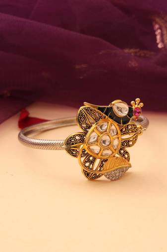 Silver peacock bracelet with floral accents