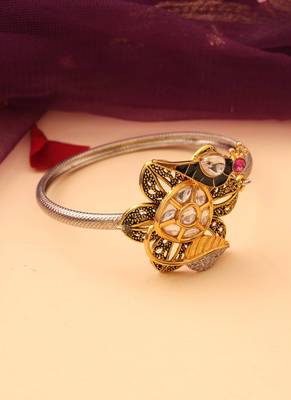 Silver peacock bracelet with floral accents 2