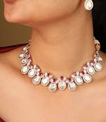 Raindrop-shaped transparent stone necklace with red accents & matching earrings