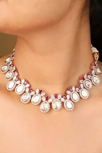 Raindrop-shaped transparent stone necklace with red accents & matching earrings