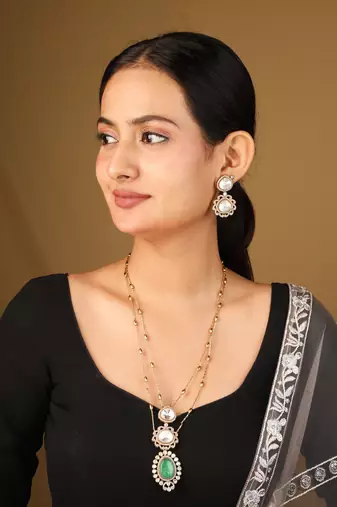 Elegant green and white stone pendant necklace with detailed accents
