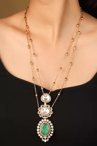 Elegant green and white stone pendant necklace with detailed accents