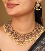 Gold-plated guttapusalu necklace with red stone accents, jhumkis & pearl pendant