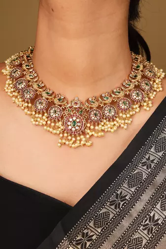 Gold-plated guttapusalu necklace with red stone accents, jhumkis & pearl pendant
