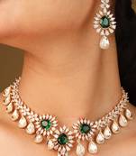 Statement necklace with green stones and american diamonds