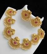 Exquisite elephant motif gold necklace set with pearl accents - traditional indian jewelry"