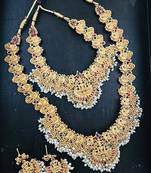 Gold-plated traditional goddess lakshmi temple jewellery bridal set with ruby stone long haram double necklace set