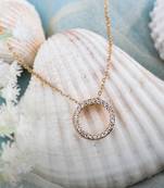  delicate gold-toned necklace with circular pendant, sparkling cubic zirconia stones