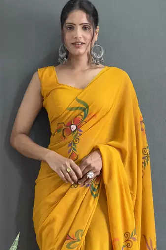 pre draped mustard faux georgette hand printed saree