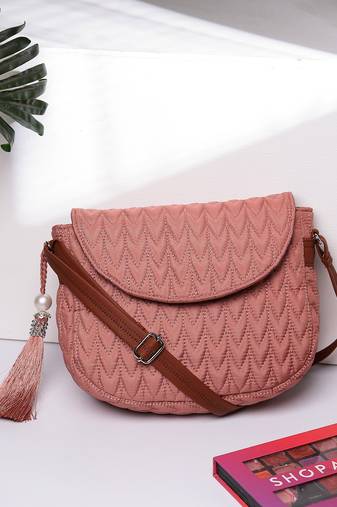 uno coral & tan polyester & vegan leather chevron quilted sling bag