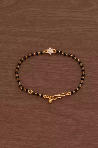 Black bead bracelet with diamond flower one gram gold