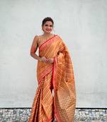 Orange pure soft zari tissue leheriya saree with contrast blouse